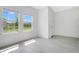 Bright room with two windows offering neighborhood views and tile flooring at 2170 Derwent Dr, Davenport, FL 33896
