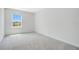 A bedroom with carpet, a window providing natural light at 2170 Derwent Dr, Davenport, FL 33896