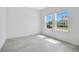 Bright room with two windows offering neighborhood views and tile flooring at 2170 Derwent Dr, Davenport, FL 33896