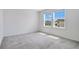 A bright bedroom with carpet and two windows providing natural light at 2170 Derwent Dr, Davenport, FL 33896