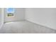 A bedroom with carpet, a window providing natural light at 2170 Derwent Dr, Davenport, FL 33896