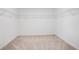 Walk-in closet with carpet and wire shelving is ready for storage at 2170 Derwent Dr, Davenport, FL 33896