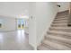 Open-concept living space with tile floors, bright light, and access to the outdoor area at 2170 Derwent Dr, Davenport, FL 33896