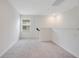Spacious loft area featuring plush carpet and a large window at 2170 Derwent Dr, Davenport, FL 33896