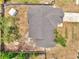An aerial view of the property showing the roof, landscaping, and fenced backyard at 2317 Clearwater Dr, Deltona, FL 32738