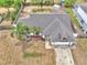 Aerial shot of a single-Gathering home highlighting the backyard's fencing and surrounding neighborhood at 2317 Clearwater Dr, Deltona, FL 32738