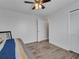This bedroom features wood floors, closet, and access to the adjoining rooms at 2317 Clearwater Dr, Deltona, FL 32738
