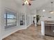 Dining area with large windows and a glimpse of the kitchen, providing ample natural light at 2317 Clearwater Dr, Deltona, FL 32738