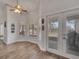 Bright dining area with French doors and multiple windows offering an abundance of natural light at 2317 Clearwater Dr, Deltona, FL 32738