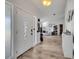 This foyer showcases the wood flooring, front door, and entrance to the living room at 2317 Clearwater Dr, Deltona, FL 32738