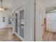 Hallway with French doors leading to a dining area, with a bathroom on the right at 2317 Clearwater Dr, Deltona, FL 32738