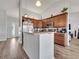 Bright kitchen features granite countertops, stainless steel appliances, and wood-look flooring at 2317 Clearwater Dr, Deltona, FL 32738