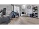 Bright living room features wood flooring, a large window, and a comfortable seating area at 2317 Clearwater Dr, Deltona, FL 32738
