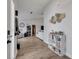 Bright living room showcases wood floors, white walls, decor, and an open concept design at 2317 Clearwater Dr, Deltona, FL 32738