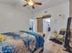 Serene main bedroom showcasing vaulted ceilings, wood floors, and a sliding barn door entrance at 2317 Clearwater Dr, Deltona, FL 32738