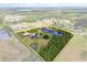 Aerial view of the property's boundary showing the home and pond at 240 Spring Forest Dr, New Smyrna Beach, FL 32168