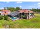Sprawling estate with well-manicured lawn, in-ground pool and brick exterior at 240 Spring Forest Dr, New Smyrna Beach, FL 32168