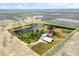 Aerial view of the property's boundaries, including home and pond at 240 Spring Forest Dr, New Smyrna Beach, FL 32168