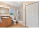 Bathroom featuring granite vanity, tub-shower combination, wood-look flooring and storage at 240 Spring Forest Dr, New Smyrna Beach, FL 32168