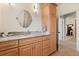 Bathroom featuring marble countertops and light wood cabinetry at 240 Spring Forest Dr, New Smyrna Beach, FL 32168