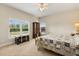 Bright bedroom with carpet flooring, and a large window showing lawn view at 240 Spring Forest Dr, New Smyrna Beach, FL 32168