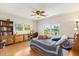 Cozy bedroom with natural light, ceiling fan, and a view of the outdoors at 240 Spring Forest Dr, New Smyrna Beach, FL 32168