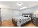 Comfortable bedroom with a skylight, closet, and hardwood floors at 240 Spring Forest Dr, New Smyrna Beach, FL 32168