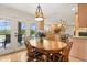 Cozy breakfast nook with backyard views, dining table, and easy access to the gourmet kitchen at 240 Spring Forest Dr, New Smyrna Beach, FL 32168