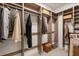 Walk-in closet featuring wood-look organizers for hanging and folded clothes storage at 240 Spring Forest Dr, New Smyrna Beach, FL 32168