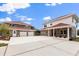 A spacious driveway connects the main house with a three-car garage and a separate guest house at 240 Spring Forest Dr, New Smyrna Beach, FL 32168