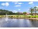 Expansive property featuring a main house, guest house, horse barn, pond with fountain and white fencing at 240 Spring Forest Dr, New Smyrna Beach, FL 32168