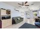 Comfortable living room with tiled floors, air conditioning, and ample natural light at 240 Spring Forest Dr, New Smyrna Beach, FL 32168