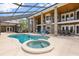 An impressive lanai and pool area with an attached spa at 240 Spring Forest Dr, New Smyrna Beach, FL 32168