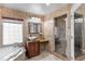 Bathroom featuring granite counters, a glass shower and a jacuzzi tub with jets at 2602 Winter Park Rd, Winter Park, FL 32789