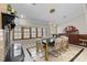 Inviting dining area with fireplace, custom lighting, and window views at 2602 Winter Park Rd, Winter Park, FL 32789