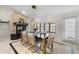 Elegant dining room featuring a stone fireplace and stylish gold-accented chairs at 2602 Winter Park Rd, Winter Park, FL 32789