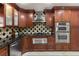 Contemporary kitchen with stainless steel appliances and sleek dark countertops at 2602 Winter Park Rd, Winter Park, FL 32789
