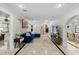 Spacious living room with travertine floors, arched entryways, and modern decor at 2602 Winter Park Rd, Winter Park, FL 32789