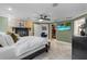 Bright main bedroom features a fireplace, TV, ceiling fan, and walk-in closet access at 2602 Winter Park Rd, Winter Park, FL 32789