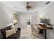 Office area with a pull out couch and desk with a view into the attached bathroom at 2602 Winter Park Rd, Winter Park, FL 32789