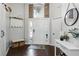 Bright home entryway featuring hardwood floors, stylish decor, and a tall window above the front door at 2611 Burwood Ave, Orlando, FL 32837