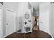 Inviting hallway with hardwood floors, white trim, and decorative accents at 2611 Burwood Ave, Orlando, FL 32837