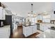 Bright kitchen with an island, stainless steel appliances, and seamless flow to the living area at 2611 Burwood Ave, Orlando, FL 32837