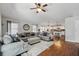 Open concept living area with seamless flow between kitchen, dining, and living spaces; features hardwood floors at 2611 Burwood Ave, Orlando, FL 32837