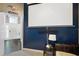 Media room with a projector screen, blue accent wall, and comfortable seating at 2611 Burwood Ave, Orlando, FL 32837