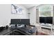 Bright office featuring a world map, dual monitors, and natural light from a window at 2611 Burwood Ave, Orlando, FL 32837