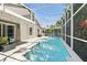 Sun-drenched screened-in pool with sparkling water, outdoor seating, and well-maintained patio at 2611 Burwood Ave, Orlando, FL 32837
