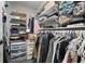 Spacious walk-in closet with ample shelving and hanging space for clothes and accessories at 2611 Burwood Ave, Orlando, FL 32837