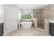 Bright bathroom featuring a soaking tub, walk-in shower, decorative lighting, and tile flooring at 2644 Slagrove Ct, Winter Garden, FL 34787