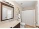Well-lit bathroom featuring a single vanity, framed mirror, and shower at 2644 Slagrove Ct, Winter Garden, FL 34787
